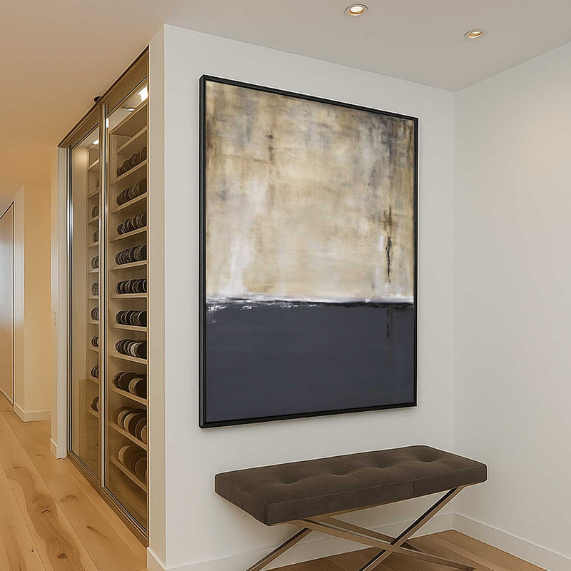 Wine cellar with a bench and abstract painting on a wall