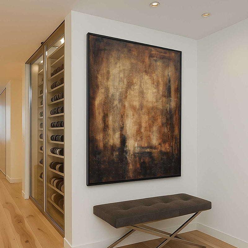 Wine cellar with a bench and abstract painting on a white wall