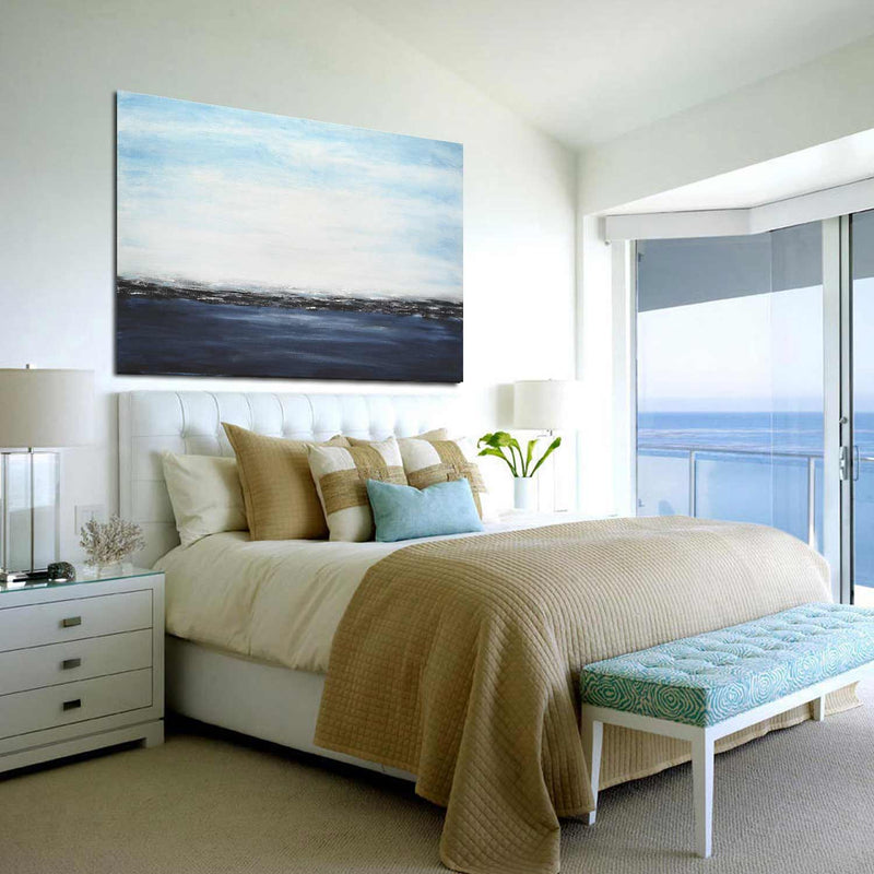Dark Blue Coastal Scene Painting Clouds Ocean above bed