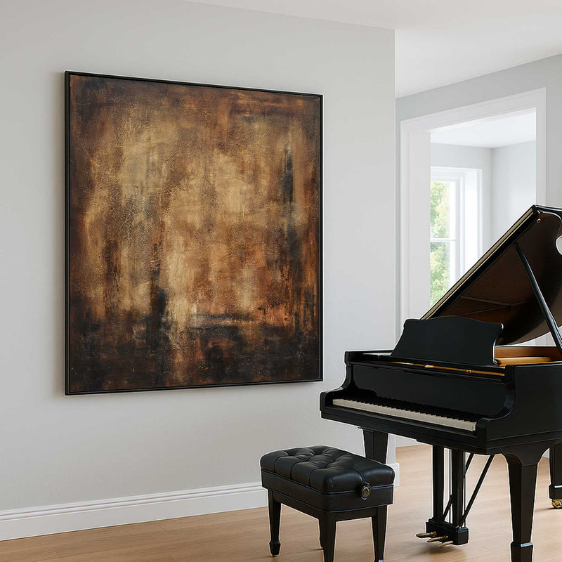 Black grand piano with a black bench in a room with a large abstract painting on the wall.