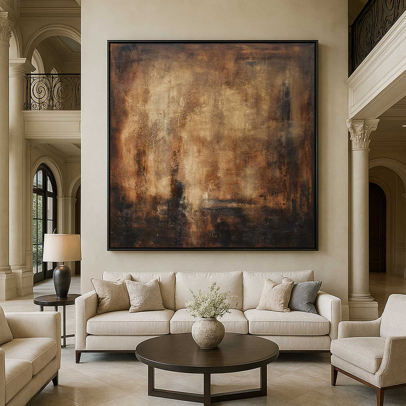 Living room with beige sofa, armchair, and abstract painting on wall