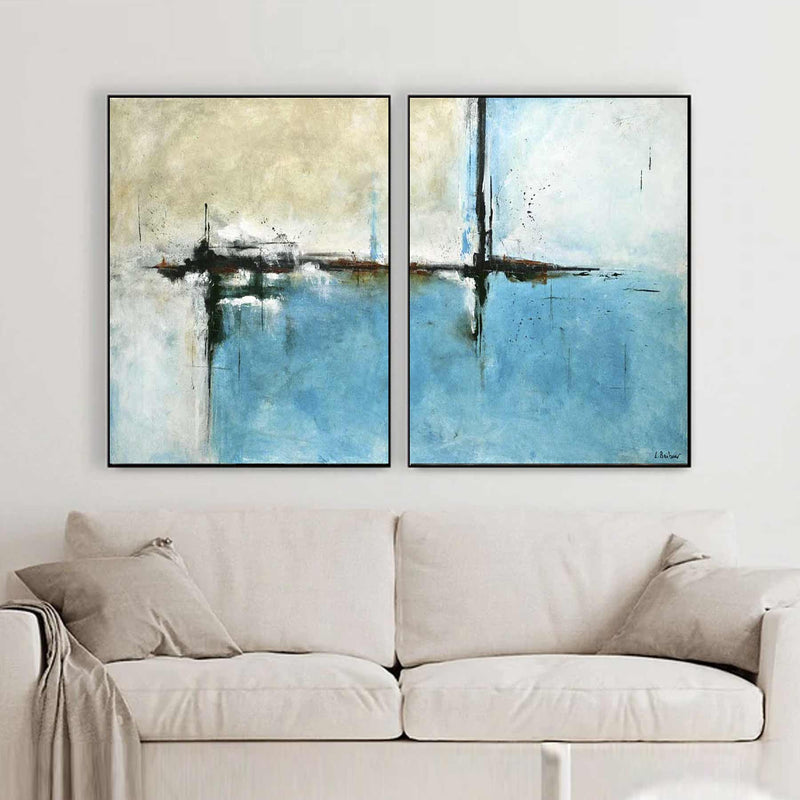 set of two turquoise paintings on canvas above couch