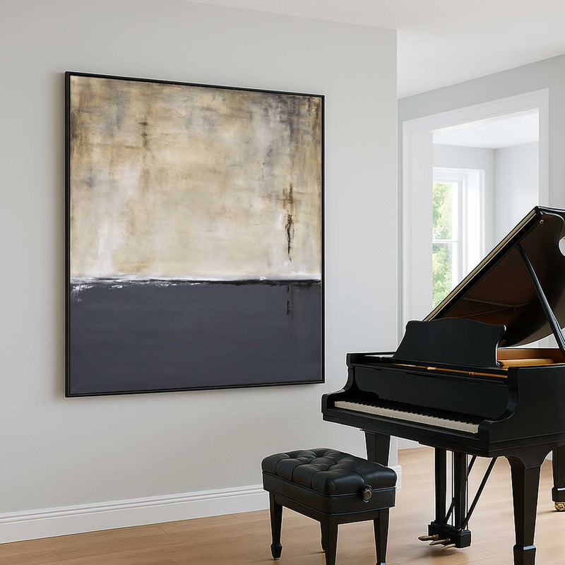 Black grand piano with a black bench in a room with a large abstract painting on the wall.