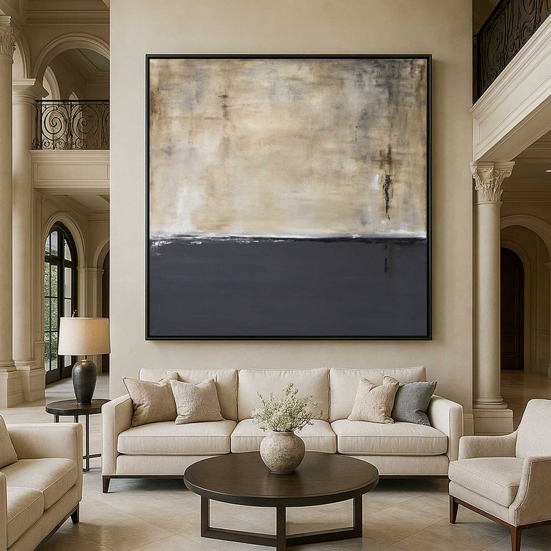 Living room with a large abstract painting on the wall, beige sofa, and decorative elements.